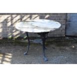A cast iron black painted pub table with later marble top, diameter 100cm, height 74cm.