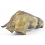 A studio ceramic model of a bull, signed to base, length 36cm.