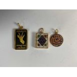 Two 18ct yellow gold and enamelled Arabic pendants, one modelled as a koran, also a National Bank of