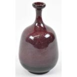 A studio pottery flambe type vase, indistinctly signed to base, height 16.5cm.