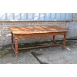 A rustic oak dining table, height 77cm, width 94cm, length 195cm.