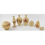 A pair of Royal Worcester blush ivory floral decorated vases, a smaller vase, a lidded pot, a larger