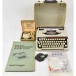 A mixed lot of collectors' items including typewriter, compass, shaver, and a quantity of records.