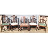 A set of four mahogany Hepplewhite style dining chairs (2+2) and another elbow chair (5).