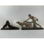 Two Art Deco plaster nudes, one seated with a dog 49 cms long and 24 cms high, the other walking