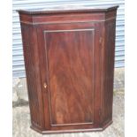 A George III mahogany straight front wall hanging corner cupboard, height 110cm.