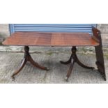 A George III style mahogany D-end twin pedestal dining table with central leaf, unextended 168cm x