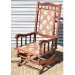 A mahogany American rocking chair.