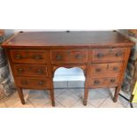 A George III mahogany and satinwood crossbanded bowfronted sideboard, on square tapering supports