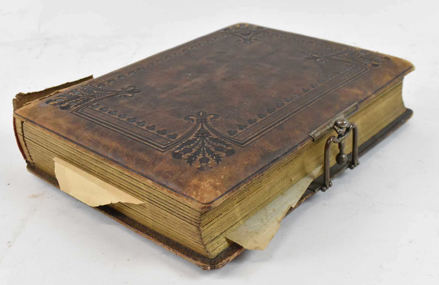 A Victorian leather bound photograph album with contents.