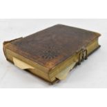 A Victorian leather bound photograph album with contents.
