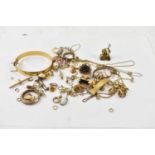 A quantity of scrap gold and yellow metal jewellery including bangles, chains, pieces of chains,