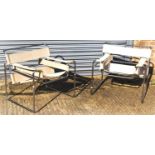 A pair of Marcel Breuer 'Wassily' tubular chrome framed chairs with canvas backs and seats.