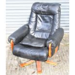 A modern black leather adjustable armchair.