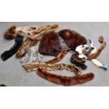 A vintage fox fur stole plus a quantity of further fur stoles, hats and gloves.