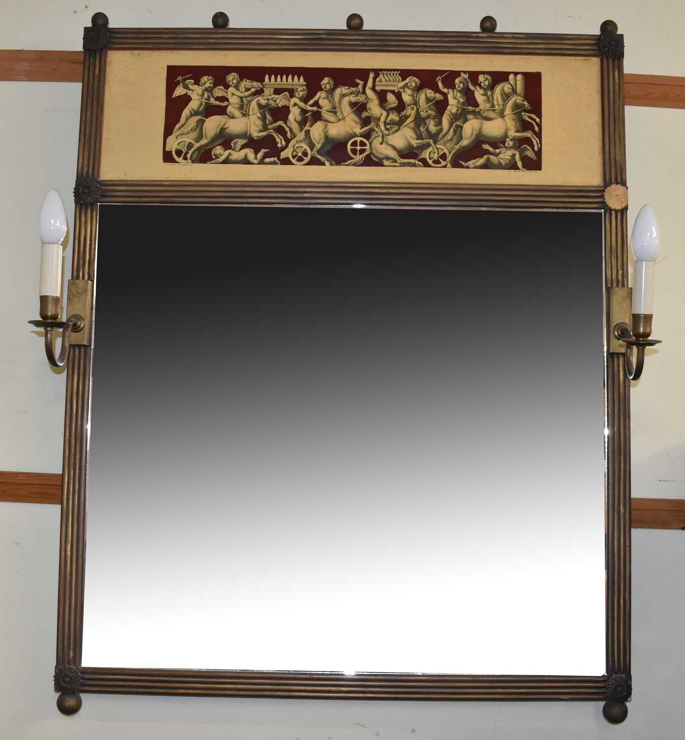 A decorative Regency style gilt framed wall mirror with Classical style frieze and set with pair