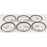 A set of six hand painted Royal Worcester plates, 19.5 cms diameter.