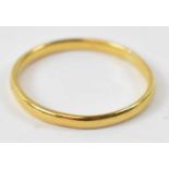 A 22ct yellow gold wedding band, size P, approx 2g.