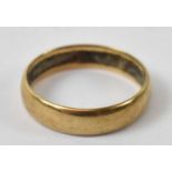 An 18ct yellow gold wedding band, size N, approx 3.3g.