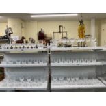 A large quantity of Waterford Crystal glassware including a set of glasses, decanters, plates (