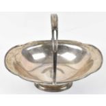 HENRY MATTHEWS; a George V hallmarked silver oval footed bowl with swing handle, Birmingham 1929, 26