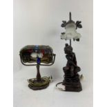 Two decorative table lamps, one in a Tiffany style with dragonfly, the second a figure of a girl