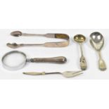 A small quantity of various hallmarked silver items including a magnifying glass, a pickle fork,