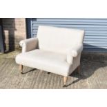 A modern beige two seater upholstered sofa, width 103cm, depth 68cm, height 87cm.
