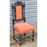 A late Victorian ebonised oak hall chair with barley twist columns.