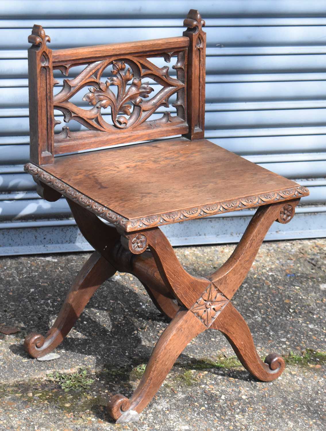 A small 19th century oak Gothic style side chair with carved decoration, height 72cm.