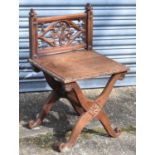 A small 19th century oak Gothic style side chair with carved decoration, height 72cm.