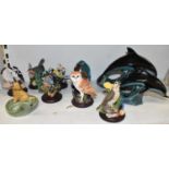 A pair of Poole Pottery dolphins and seven birds from The Country Bird Collection, and a Wade