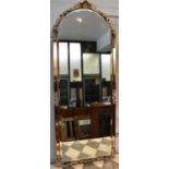 An Art Deco style wall mirror set with four peach glass panels, 113cm.