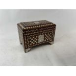 An Eastern hardwood scribe's box profusely inlaid with mother of pearl, width 39cm, height 27cm.