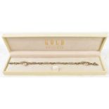 A 9ct white and yellow gold bracelet set with approx forty small diamonds, length 20cm, approx 10.