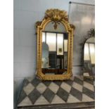 An ornate reproduction Franklin mint ‘King Louis’ wall mirror, height 95cm.