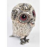 A Victorian hallmarked silver novelty pepper in the form of an owl with hinged cover enclosing a