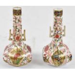A pair of Derby Imari vases of hexagonal baluster form, height 17cm.Condition Report: Some rubbing