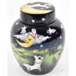 MOORCROFT; a black and green glazed ginger jar decorated with scene from 'The Owl and the Pussy