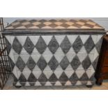 A large pine three drawer chest painted in black and white with diamond design, width 123cm,