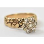 A 18ct yellow gold ring set with seven small white stones, size K, approx 3.9g.