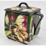 MOORCROFT, a twin handled lidded jar decorated in the 'Pencarrow' pattern, indistinctly signed to