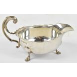 VINERS; a George V hallmarked silver sauce boat with flying scroll handle, Sheffield 1931, approx