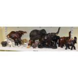 A collection of ten wooden models of elephants also a hardstone, glass and other models of