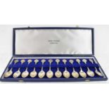 JOHN PINCHES; a set of twelve hallmarked silver apostle spoons with anatomic tops, hallmarked London