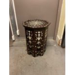An Eastern carved hardwood and mother of pearl inlaid octagonal occasional table, height 50cm.