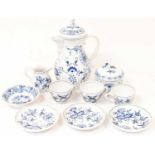 MEISSEN; a 20th century blue and white coffee pot, height 23cm, a set of three cups and saucers,