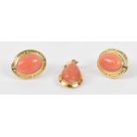 A pair of 14ct yellow gold earrings with pink coloured central set stones, also a matching 14ct