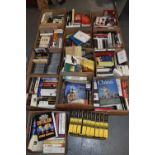 Fourteen boxes containing a huge collection of books including finance, novels, history, music,