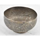 An Eastern white metal bowl with embossed decoration, diameter 11cm, 2ozt/64.4g.